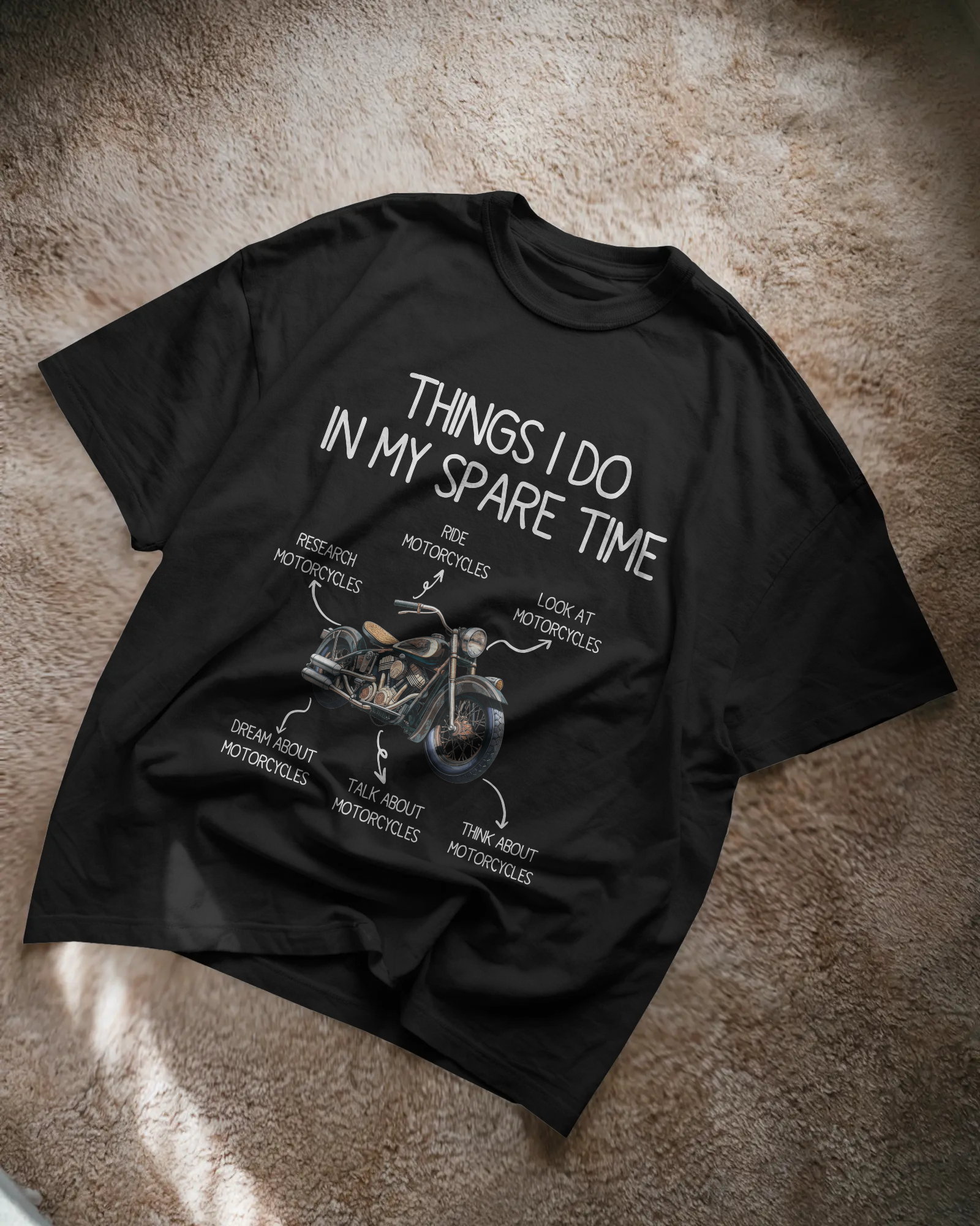 Black t-shirt with motorcycle-themed text on a textured surface